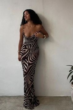 This bold maxi dress features an eye-catching combination of leopard and zebra prints, creating a striking pattern that's sure to turn heads. With its comfortable straps and flowing silhouette, it's perfect for outings or exotic vacations. Details: Elasticity: Slight Stretch Fabric Type: POLYESTER Silhouette: STRAIGHT Neckline: V-Neck Material: POLYESTER Size (IN) Bust Size Skirt Length Waist Size Hip Size S 26.77-37.01 44.49 25.20-29.13 31.50-37.01 M 28.35-38.58 45.28 26.77-30.71 33.07-38.58 L Trendy Zebra Print Dresses, Summer Black Zebra Print Maxi Dress, Sleeveless Zebra Print Dress For Vacation, Summer Black Maxi Dress With Zebra Print, Sleeveless Zebra Print Vacation Dress, Trendy Zebra Print Spring Dresses, Black Zebra Print Maxi Dress, Exotic Vacations, Strap Maxi Dress