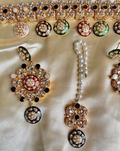 Traditional and Simple but so unique! This kundan choker set comes with matching jhumka, tikka and is in gold and multi tones with meenakari work. Antique gold plating and multi colored stones make it a beautiful piece that will look great with any color outfit! This lightweight and elegant necklace is perfect for any bridesmaid, bride, sangeet or any occasion or even as a gift for any occasion as any one who loves jewelry will love this statement piece. It has beautiful colors that really make Multicolor Kundan Jhumkas With Zari Work, Multicolor Kundan Sets With Latkans, Festive Multicolor Meenakari Tikka, Heavy Multicolor Kundan Tikka, Heavy Kundan Multicolor Tikka, Festive Multicolor Kundan Tikka, Multicolor Kundan Tikka In Temple Jewelry Style, Multicolor Kundan Tikka For Festivals, Multicolor Kundan Tikka As A Gift