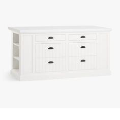 a white cabinet with four drawers and two open shelves on the bottom, in front of a