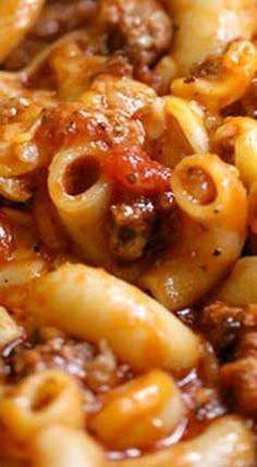 a close up view of pasta with meat and sauce