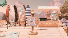 there are many surfboards on display in the store front window and behind them is a sign that says surf shop