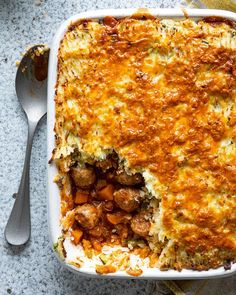 a casserole dish with meat and vegetables in it