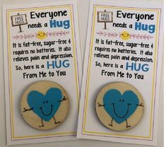 two magnets that say everyone needs a hug