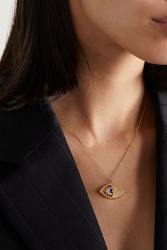 L'Atelier Nawbar's 'Eye On Biladi' necklace is meant to celebrate the beauty of your heritage as the arabic term 'Biladi' translates to 'my country.' Made from 18-karat gold, it's strung with a small pendant featuring an evil eye that's inlaid with lapis lazuli and traced with sparkling diamonds. Elegant Gold Evil Eye Necklace, Elegant Gold Evil Eye Necklaces, Wedding Fine Jewelry Necklaces With Diamond Eyes, Wedding Necklaces With Diamond Eyes, Spiritual Gold Eye-shaped Necklace, Yellow Gold Round Pendant Jewelry With Diamond Eyes, Luxury Evil Eye Necklace Gift, Gold Plated Evil Eye Amulet Jewelry, Gold Spiritual Necklace With Diamond Eyes