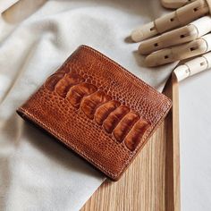 Men's leather Alligator bifold wallet  Thank you for your trust in ordering from us. We appreciate your expressions of appreciation and are especially grateful for the recent wallet order. Hope that our products will bring good luck to you. Thank you for choosing our store to supply your needs. We look forward to sharing your success. 1) Product Description: Dimensions: approx. 115mm x 90mm Color: Brow Material: Outer - Alligator Leather Interior - Epsom Leather Made in Vietnam. 2) Shipping and handling: - We will send through the shipping unit of the shipping enterprises in Vietnam. - After receiving your order, we will take 5 to 7 days to process the product and then ship it to you. - It will take 10-20 days to arrive - Contact us if you need a faster delivery service - Orders placed ove Luxury Brown Trifold Wallet As Gift, Luxury Brown Trifold Wallet Gift, Leather Bifold Wallet With Crocodile Pattern, Bifold Wallet With Crocodile Pattern For Gift, Bifold Wallet With Crocodile Pattern As Gift, Crocodile Pattern Bifold Wallet As A Gift, Gifts For Him Birthday, Birthday Gifts For Men, Good Luck To You