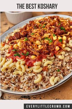 a plate full of pasta with sauce and other food items on it, along with the caption egyptian koshari