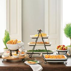 a table topped with lots of food and plates filled with different types of foods on top of it