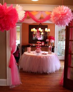 an image of a table with pink and white decorations