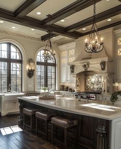 a large kitchen with an island in the middle and two windows on each side that look out onto the outdoors