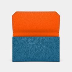 Turchese Leather and Orange Felt Carry-all Wallet featuring one main pocket that can accommodate loads of business cards, or cards with cash folded in four. Make it special! Personalise your case with your initials embossed onto the front of the case, to do so please select "Yes" from the Monogramming drop-down menu and leave a note with your initials below. Blue Leather Card Holder For Daily Use, Orange Travel Wallets With Interior Card Slots, Blue Rectangular Leather Card Holder, Orange Rectangular Wallets With Card Slots, Orange Leather Wallet With Card Slots, Tray Organization, Business Card Cases, Red Felt, Continental Wallet