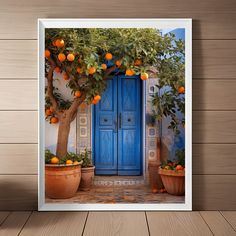 an orange tree in front of a blue door with potted plants on the outside