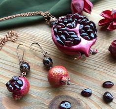 "Garnet Pomegranate pendant & earrings Botanical Fruit jewelry Garnet Luxury Feminine jewelry set Elegant Royal Red pendant Mother Wife gift Original pomegranate jewelry set of juice pendant and earrings. Inside pomegranate - natural garnet gemstones. all beads - garnet. Skin - polymer clay. Earrings is different.. one - full small fruit, second - open. This pendant looks very naturally.. like a real bright and juice pomegranate. I think this luxury jewelry can be the perfect gift for mother Spiritual Gemstone Jewelry Sets For Gifts, Valentine's Day Gift Necklaces With Matching Earrings, Red Pendant Jewelry Sets For Gifts, Unique Necklace With Matching Earrings For Gift, Handmade Jewelry For Celebration And Gift Season, Handmade Festive Jewelry For Valentine's Day, Traditional Garnet Jewelry Gift, Traditional Garnet Jewelry For Gifts, Traditional Garnet Jewelry As Gift