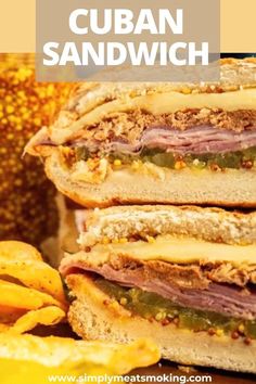 the cuban sandwich is stacked on top of each other with some chips next to it