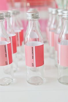 several empty glass bottles with labels on them