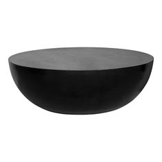 a black bowl sitting on top of a white table