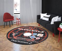 a living room with a black couch and red chairs in front of a white wall