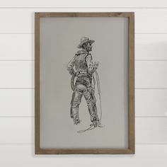 Embrace the rugged charm of the Wild West with our art print sketch featuring a cowboy gazing off into the distance. With his lasso in one hand and bridle in the other, he embodies the spirit of adventure and independence. Clad in chaps and spurs, his attire exudes authenticity. Hang this sketch in your home office, to infuse your space with the timeless allure of the frontier. Cowboy Sketch, Print Sketch, Farmhouse Style Frames, Christmas Loungewear, Brighton Houses, Fall Graphic, Far West, The Wild West, Alder Wood