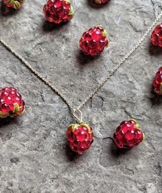 Growing up, my mom planted raspberry bushes around the perimeter of our house. She'd make jam every summer and give it as gifts for Christmas. I'd help her sometimes ❤️ there is something grounding about picking berries in your own backyard 🍓 This is a handblown glass raspberry necklace. The berry is anatomically correct in size and detail. The berries are bright red and each bead is 12-15 mm in length. Pictured is a gold chain, but I have many different metals and lengths to choose from ✨ Than Raspberry Necklace, Raspberry Bushes, Berry Necklace, Picking Berries, Make Jam, Fruit Necklace, Raspberry Fruit, Quirky Jewelry, Pretty Jewelry Necklaces