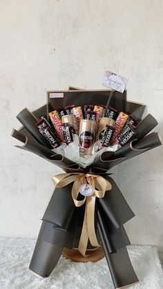 a bouquet of chocolates wrapped in brown paper