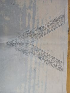 an old piece of paper with designs on it