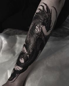 Mean Dragon Tattoo, Dragon Tattoo Fantasy Mythical, Fantasy Dragon Tattoo Arm, Dragon Rib Tattoo Men, Dragon Wrapped Around, Black Dragon Tattoo Arm, Water Dragon Tattoo Designs, Black And Grey Underwater Tattoo, Best Black Tattoo Ideas