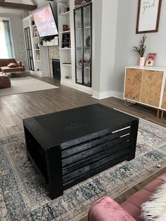 a living room filled with furniture and a flat screen tv