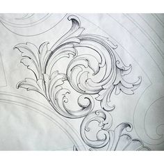 an intricate design is shown on the back of a white sheeting material with swirls and