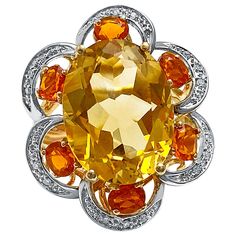 Centering an approximately ~7 carat Orangy-Yellow Oval-Cut Citrine, set in 14K Yellow/White Gold, and accented by six oval-cut orange Citrines and 30 round-brilliant cut diamonds Details: ✔ Stone: Citrine ✔ Stone Cut: Oval, Brilliant ✔ Stone Weight: 7 carats (center stone) ✔ Setting: 14K Yellow/White Gold ✔ Ring: 6 pcs Oval-cut Citrine, ~1 carat total; 30pc round-cut diamonds ✔ Dimensions 2.8cm x 1.8cm ✔ Ring Size: 7 U.S. ✔ Total Weight: 7.6g Luxury Multi-stone Yellow Gemstones, Luxury Yellow Multi-stone Gemstones, Luxury Multi-stone Yellow Diamond Ring, Yellow Multi-stone Round Gemstones, Luxury Yellow Multi-stone Jewelry, Luxury Yellow Gemstones With Accent Stones, Yellow Multi-stone Diamond Ring Fine Jewelry, Yellow Multi-stone Diamond Ring In Fine Jewelry Style, Exquisite Yellow Gold Diamond Gemstones