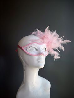 Elegant and whimsical Pink Feather Masquerade Mask for girls and women! This enchanting mask features a delicate white base with intricate pink filigree detailing, accented by a lavish arrangement of soft pink feathers on one side. Perfect for masquerade balls, themed parties, or any event where you want to make a stylish statement, the Pink Feather Masquerade Mask adds a playful yet sophisticated touch to your ensemble. Its comfortable fit ensures you can wear it effortlessly throughout the nig Pink Masquerade Mask For Carnival, White Eye Mask Masquerade Mask As Gift, Pink Eye Mask For Masquerade, Kids Princess Costume, Pink Masquerade Mask, Pink Masquerade, Mardi Gras Kid, Kids Party Packs, Princess Costume Kids