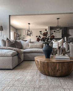 a living room filled with furniture and a large mirror