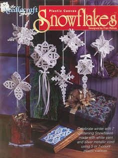 a magazine cover with snowflakes hanging from it's sides and presents on the table