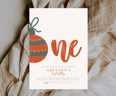 an orange and green christmas ornament is on the front of this holiday party card