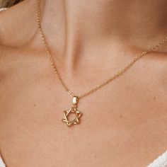 Adorn in style with this 14k gold-filled Star of David necklace. Fashionable Jewish Magen David pendant for women. Shower-safe, tarnish-resistant, adjustable chain--perfect for everyday elegance and gifting. Choose between: A stunning gold hue, crafted from 14K gold-filled material. An elegant silver shade, made of stainless steel with a rhodium cover. Classic Yellow Gold Star Of David Jewelry, Elegant Yellow Gold Star Of David Necklace, Minimalist Gold Necklace With Star Of David, Classic Star Of David Jewelry For Gift, Everyday Star Of David Jewelry With Star Charm, Dainty Star Of David Jewelry With Adjustable Chain, Yellow Gold Star Of David Jewelry With Delicate Chain, Elegant Star Of David Necklace With Delicate Chain, Classic Star Of David Necklace As Gift