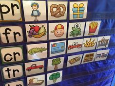 there are many different pictures on the wall in this classroom display, including letters and numbers