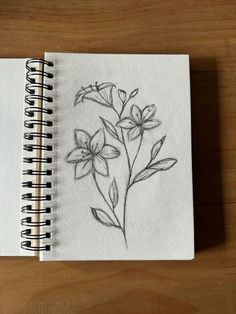 a drawing of flowers is shown on a notebook