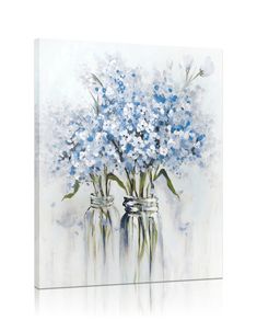 two vases filled with blue and white flowers