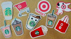 various starbucks stickers and decals on a table