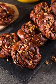 chocolate muffins with walnuts on a slate board