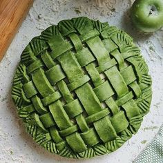 an apple pie sitting on top of a table