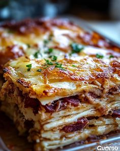 a stack of lasagna stacked on top of each other with cheese and meat