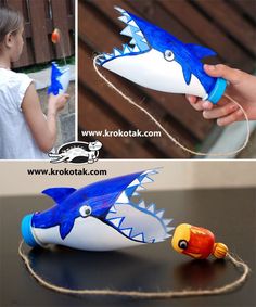 an image of a toy shark with its mouth open and toothbrushes in it's mouth