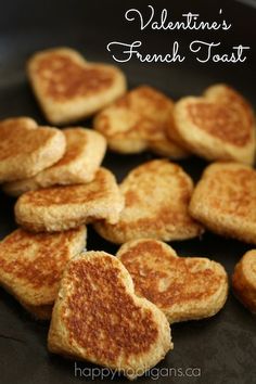 heart shaped french toast on a black plate