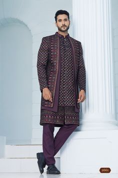 Make a style statement this season with this exclusive 3-piece velvet designer jodhpuri plus size wedding sherwani. A perfect gift for the groom of any wedding, this ethnic partywear outfit is sure to turn all heads at the next ceremony you attend. Exquisitely designed from high quality fabric, this sherwani features a vibrant multi-color embroidery for a stunning and unique look. The sherwani is adorned with a fancybutton necklace to complete the look--no doubt making it an absolute show-stoppe Indowestern Men, Indo Western For Men, Indowestern Dress, Indowestern Sherwani, Mens Sherwani, Western Suits, Wedding Sherwani, Indo Western Dress, Purple Colour