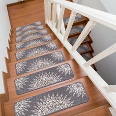 the stairs are lined with rugs on them