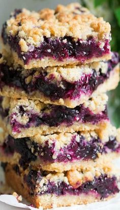 blueberry crumb bars stacked on top of each other