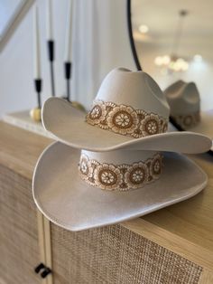 This cowgirl hat is the perfect addition to your western-themed outfit. Made of high quality suede, it only looks great but is also long lasting. Tejana hat type: this hat features a classic tejana design, which adds a touch of authenticity to your western look. Fitted Hat: the fitted styles ensures that this hat stays comfortably in place all day long.  Care Instructions:  to keep this cow girl hat looking its best, simply dry clean it as needed.  Fall accessory must-have: the perfect accessory for fall season for ladies who love the western style fashion. Custom Brimmed Fedora For Western-themed Events, Custom Fedora For Western-themed Events, Handmade Western Fedora For Western-themed Events, Western Fedora Hat For Wedding, Handmade Western Fedora For Country Events, Fitted Southwestern Fedora Hat, Fitted Southwestern Style Fedora Hat, Country Style Fitted Felt Hat For Kentucky Derby, Southwestern Style Fitted Fedora Hat