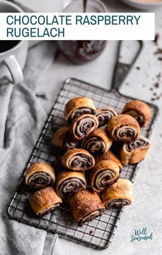 chocolate raspberry rolls on a cooling rack with coffee in the background and text overlay