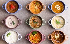 six different types of soups in bowls on a table