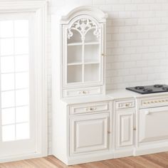 a white kitchen with an oven and cabinets