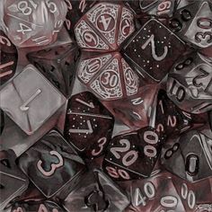 a pile of metal dice with numbers on them